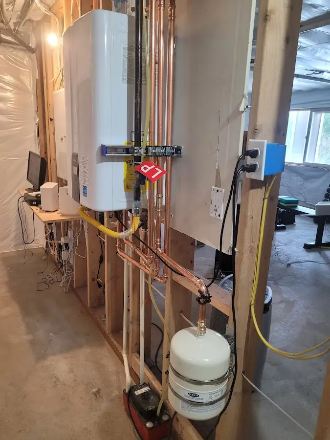 Licensed plumber repairing a kitchen sink in Captain Cook